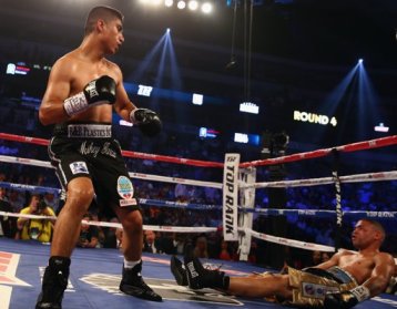 Mikey Garcia (left) knocks out Juan Manuel Lopez in the fourth round of their June 15 featherweight bout from Dallas, Texas (Image Credit: Tom Pennington/Getty Images).