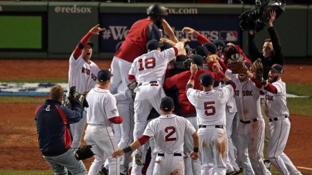 The Boston Red Sox celebrate their Game 6 clincher, and their third World Series title since 2004 (photo: Nancy Lane / Boston Herald).